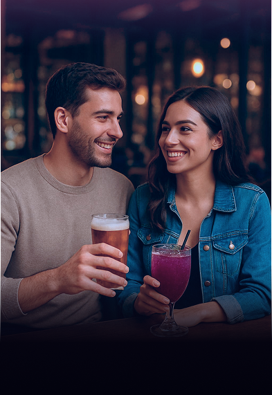 Couple enjoying drinks at bar